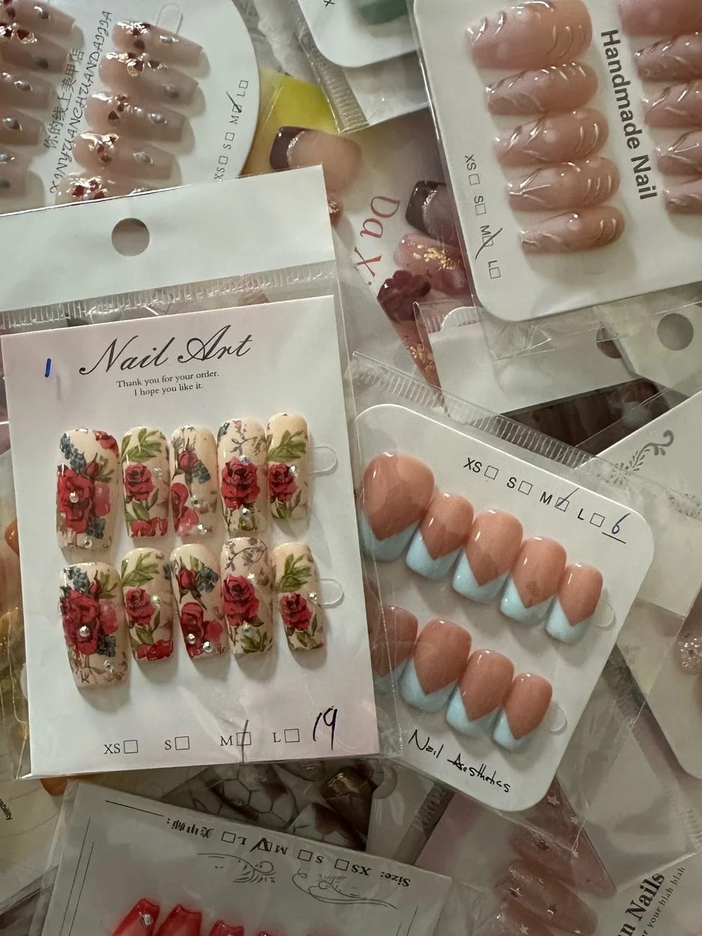 100 Sets of SURPRISE Assorted Press-On Nail Sets - Floral, Pink, Blue, Neutral